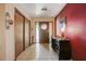 Foyer featuring a decorative front door, tile flooring, and antique furniture at 5670 Sw 34Th St, Ocala, FL 34474