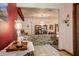 Foyer with brick accent wall, chandelier, and tile flooring at 5670 Sw 34Th St, Ocala, FL 34474