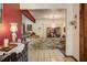 Foyer with brick accent wall, chandelier, and tile flooring at 5670 Sw 34Th St, Ocala, FL 34474