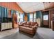 Living room featuring carpet, a sofa, plenty of natural light, and a vaulted ceiling at 5670 Sw 34Th St, Ocala, FL 34474