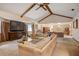 Bright living area with vaulted ceilings, a large TV, and an open layout into the dining area at 5670 Sw 34Th St, Ocala, FL 34474