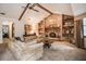 Living room featuring a brick fireplace, vaulted ceilings, and comfortable seating area at 5670 Sw 34Th St, Ocala, FL 34474