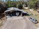 A large shop/garage and RV parked under cover at 12308 Se 112Th Avenue Rd, Belleview, FL 34420