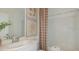 Clean bathroom with a shower-tub combo, neutral decor, and vanity sink at 2663 Fernleaf St, Auburndale, FL 33823