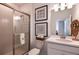 Bright bathroom featuring a glass-enclosed shower, a modern vanity, and stylish decor at 16198 Honey Harvest St, Winter Garden, FL 34787