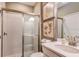 Contemporary bathroom features a glass shower, a white vanity, and stylish decor at 16198 Honey Harvest St, Winter Garden, FL 34787