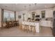 Eat-in kitchen featuring stainless steel appliances, large island, pendant lighting, and light cabinets at 16198 Honey Harvest St, Winter Garden, FL 34787