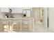 Bright kitchen features modern appliances, sleek countertops, and a breakfast bar with seating at 2615 Skyline Loop, Kissimmee, FL 34758