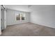Neutral bedroom featuring carpeting, a window, and natural light at 348 Lake Smart Cir, Winter Haven, FL 33881