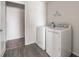 Laundry room with modern washer and dryer, plus a closet with ample storage space at 348 Lake Smart Cir, Winter Haven, FL 33881