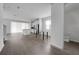 Open-concept floor plan with a modern kitchen, island, and view of the powder room at 348 Lake Smart Cir, Winter Haven, FL 33881