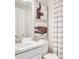 Modern bathroom featuring vanity with chrome faucet, updated fixtures, and neutral-toned accents at 5260 Stone Ridge Pl, St Cloud, FL 34771