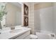 Bright bathroom featuring modern vanity, patterned shower curtain, and stylish wall art at 5260 Stone Ridge Pl, St Cloud, FL 34771