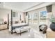 Comfortable and stylish main bedroom retreat with large windows, tray ceiling, and elegant furnishings at 5260 Stone Ridge Pl, St Cloud, FL 34771