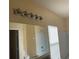Bathroom with a large mirror, modern vanity lighting and combination tub and shower at 1555 Scarlet Oak Loop # 113A, Winter Garden, FL 34787