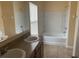 Bathroom with a double vanity and a tub and shower combination at 1555 Scarlet Oak Loop # 113A, Winter Garden, FL 34787