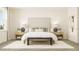 Inviting bedroom showcasing a large headboard and a stylish accent bench at 4791 Waltham Forest Dr, Davenport, FL 33837
