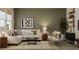 Cozy living room featuring a comfortable white sofa, stylish decor, neutral rug, and bright natural light from the window at 4791 Waltham Forest Dr, Davenport, FL 33837