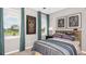 Comfortable bedroom with natural light from two windows, complemented by playful decor and a ceiling fan for added comfort at 5190 Goldfinch Dr, St Cloud, FL 34771