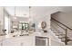Bright kitchen featuring stainless steel appliances, a center island, pendant lighting, and stairway access at 5190 Goldfinch Dr, St Cloud, FL 34771