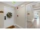 Inviting condo entrance hallway featuring neutral paint and ceramic tile flooring at 7615 Heritage Crossing Way # 102, Reunion, FL 34747