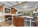 Bright kitchen with a stainless steel dishwasher and access to the outdoor patio at 7615 Heritage Crossing Way # 102, Reunion, FL 34747