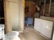 Bathroom featuring a shower, toilet, sink, and washer/dryer hookups at 24605 Ne 177Th Ter, Fort Mc Coy, FL 32134