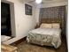 Cozy bedroom featuring a comfortable bed, patterned curtains, and a tranquil atmosphere at 24605 Ne 177Th Ter, Fort Mc Coy, FL 32134