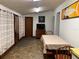 Functional dining space featuring tiled floors, neutral walls, and exterior door at 24605 Ne 177Th Ter, Fort Mc Coy, FL 32134