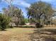 Charming home surrounded by mature trees and vibrant azaleas, offering a serene setting at 24605 Ne 177Th Ter, Fort Mc Coy, FL 32134