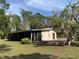 Exterior of the property featuring a screened in porch at 24605 Ne 177Th Ter, Fort Mc Coy, FL 32134