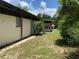 Well-maintained home exterior with green space. Great potential for outdoor enjoyment at 24605 Ne 177Th Ter, Fort Mc Coy, FL 32134