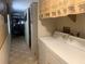 Hallway view showing a washer and dryer setup at 24605 Ne 177Th Ter, Fort Mc Coy, FL 32134