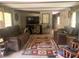 Living room featuring a spacious layout and comfortable seating at 24605 Ne 177Th Ter, Fort Mc Coy, FL 32134