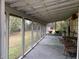 Relaxing screened-in back porch with paver flooring and peaceful outdoor views at 24605 Ne 177Th Ter, Fort Mc Coy, FL 32134