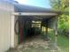 Shed interior provides covered storage and workspace for equipment at 24605 Ne 177Th Ter, Fort Mc Coy, FL 32134