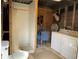 Rustic shed interior with shower, toilet, sink, fan, washer, and dryer at 24605 Ne 177Th Ter, Fort Mc Coy, FL 32134