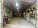 Long storage shed interior with shelves and tables at 24605 Ne 177Th Ter, Fort Mc Coy, FL 32134