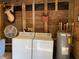 Shed interior view features a washer, dryer, water heater, and fan at 24605 Ne 177Th Ter, Fort Mc Coy, FL 32134