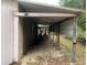 View of storage shed and covered area for equipment at 24605 Ne 177Th Ter, Fort Mc Coy, FL 32134