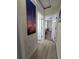 Hallway with a view of a bedroom and stylish decor at 15257 Se 94Th Ter, Summerfield, FL 34491