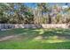 Large backyard is fully fenced with mature landscaping and plenty of room to relax and entertain at 4111 Se 131St Ln, Belleview, FL 34420