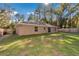 Large backyard with mature trees and a privacy fence at 4111 Se 131St Ln, Belleview, FL 34420