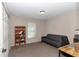 Bright bedroom features a futon, a large closet, and a storage cabinet at 4111 Se 131St Ln, Belleview, FL 34420