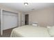 Bright bedroom boasts a large closet with ample storage space and neutral-toned walls at 4111 Se 131St Ln, Belleview, FL 34420