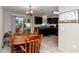 Eat-in kitchen featuring dark cabinets, stainless steel appliances, and sliding glass door to the backyard at 4111 Se 131St Ln, Belleview, FL 34420