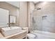 Modern bathroom with a combined shower and tub featuring gray patterned tile at 7540 Brooklyn Dr, Kissimmee, FL 34747