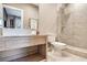 Stylish bathroom featuring a vessel sink, shower, and tile accent wall at 7540 Brooklyn Dr, Kissimmee, FL 34747