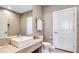 Well-lit bathroom with a modern vanity, toilet, and linen storage at 7540 Brooklyn Dr, Kissimmee, FL 34747