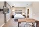 Comfortable bedroom with a king-size bed, accent furniture, and ample natural light at 7540 Brooklyn Dr, Kissimmee, FL 34747